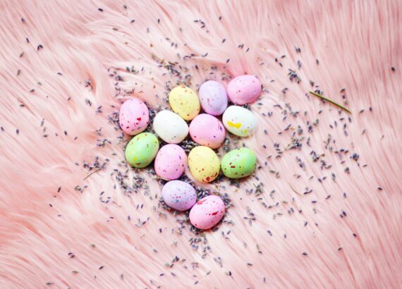 easter eggs on pink fur pastel colors